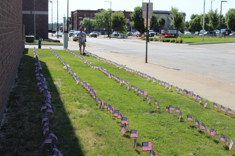 Muscatine Firefighter places 343 flags to honor 9/11 First Responders