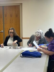 trinity muscatine staff makes packages for dv shelter